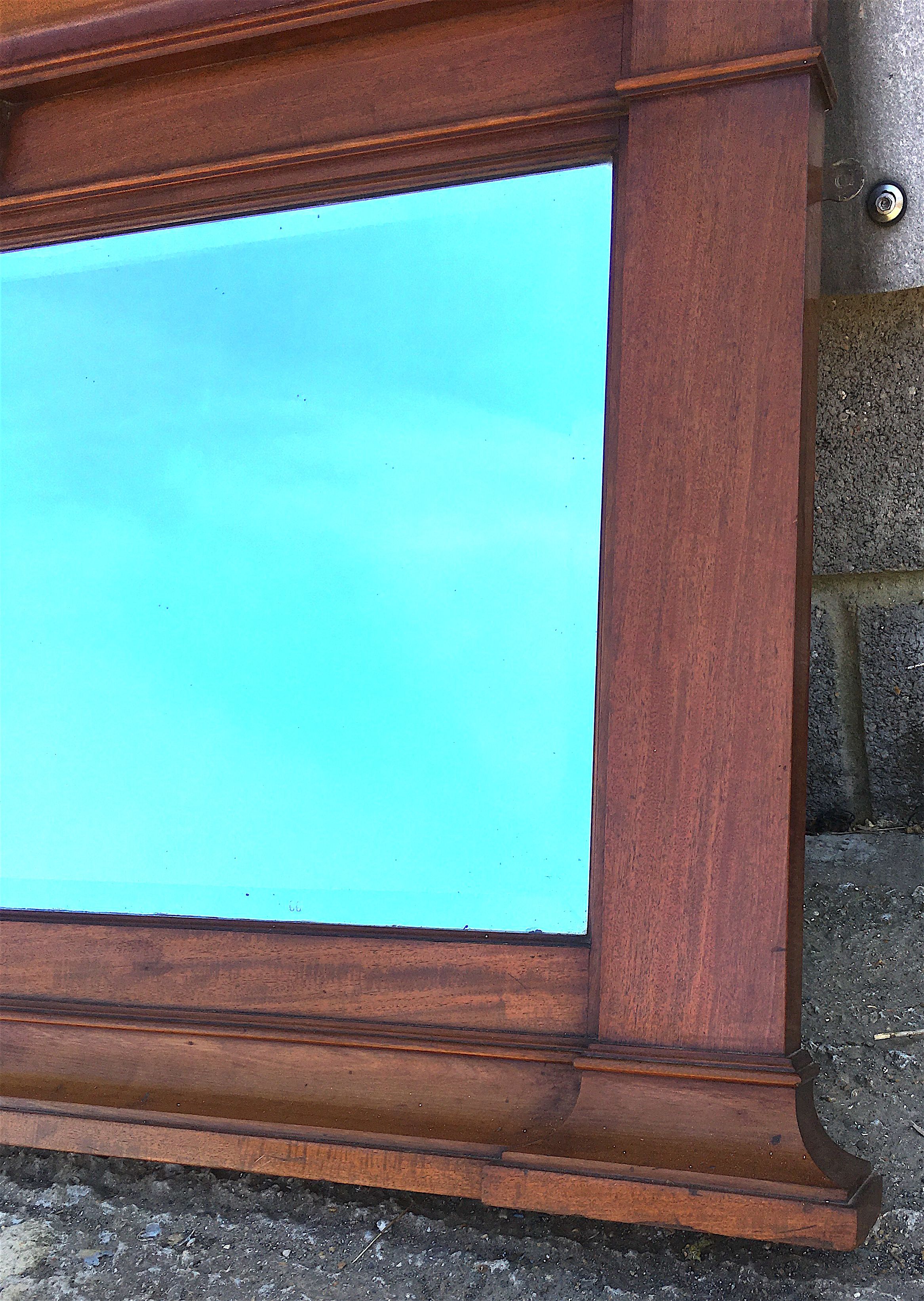 An early 20th century mahogany overmantel mirror, width 144cm, height 77cm